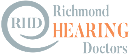 Logo for Richmond Hearing Doctors featuring the initials RHD inside an ear-shaped design, with Richmond HEARING Doctors written beside it; HEARING is in orange, other text in gray.