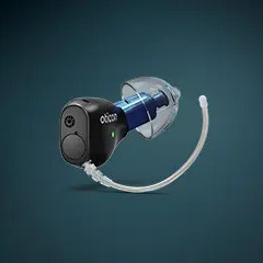 A close-up image of a small, in-ear hearing aid device with a clear tube and blue accent, displayed against a dark teal background.